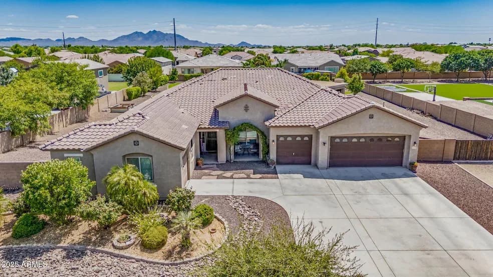 Aerial view of an Arizona home with a tile roof and courtyard