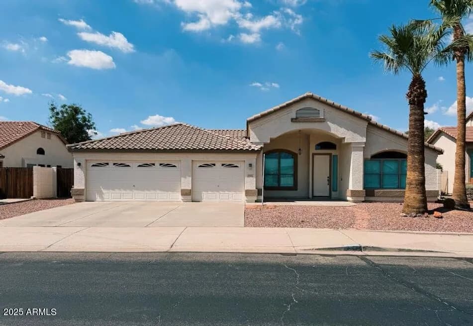 Arizona home with a three-car garage and palm trees